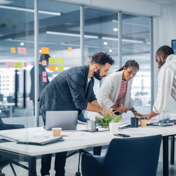 three professionals working in a marketing agency